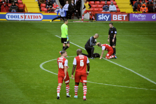 Friendly Pompey vs Charlton 2nd August 2014.  Solly receives treatment.